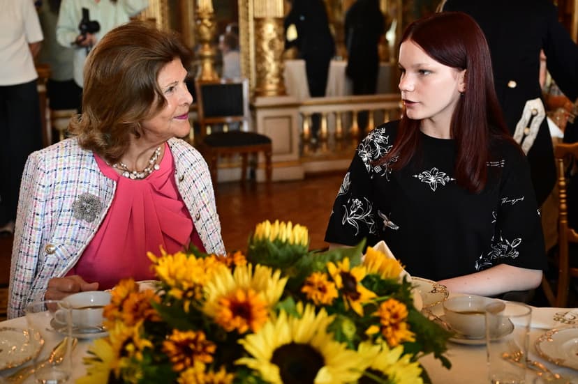 Queen Silvia with ukrainian children at the Royal Palace